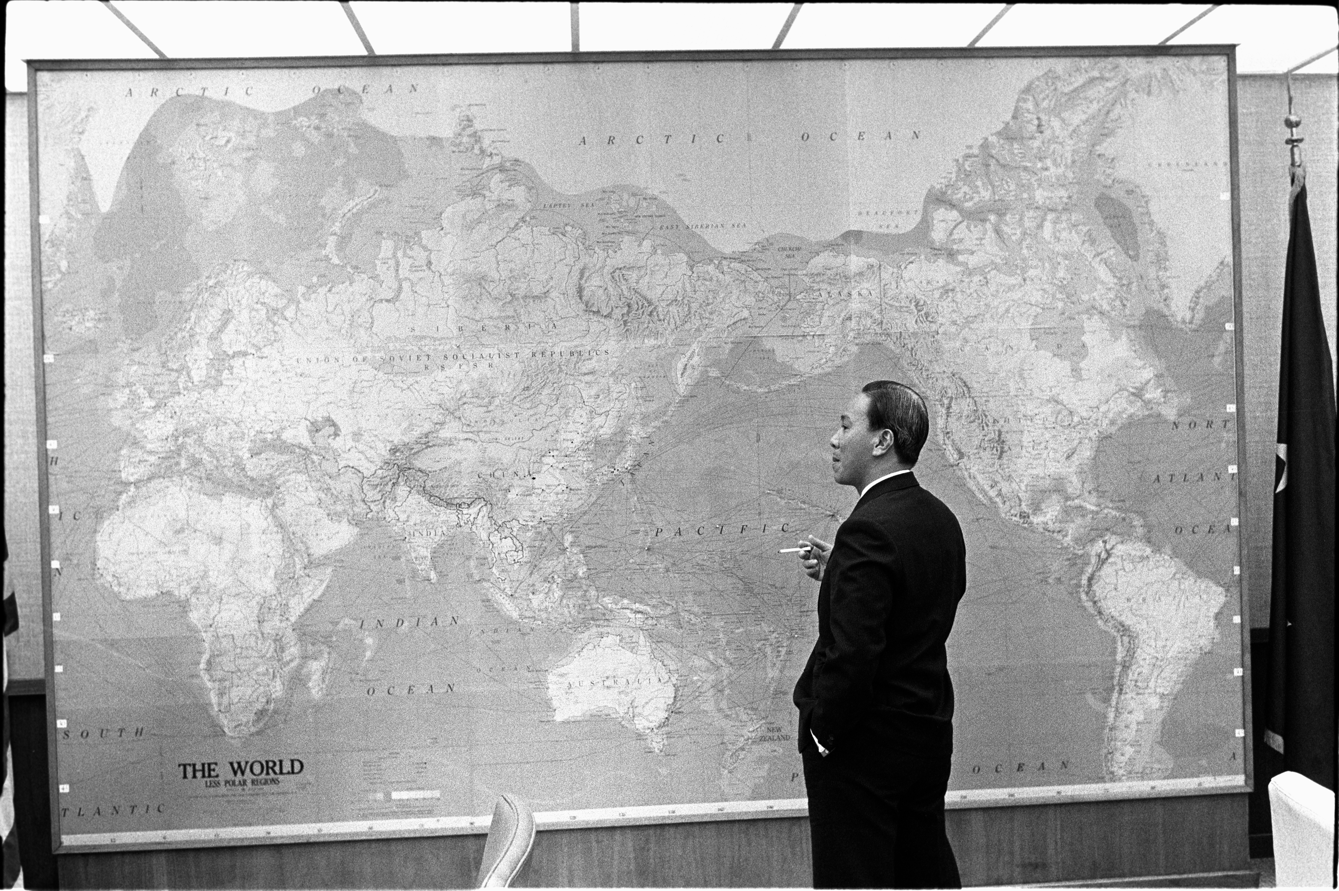President Nguyen Van Thieu of South Vietnam standing in front of world map. LBJ Library photo by Yoichi Okamoto. #A6588-2a.