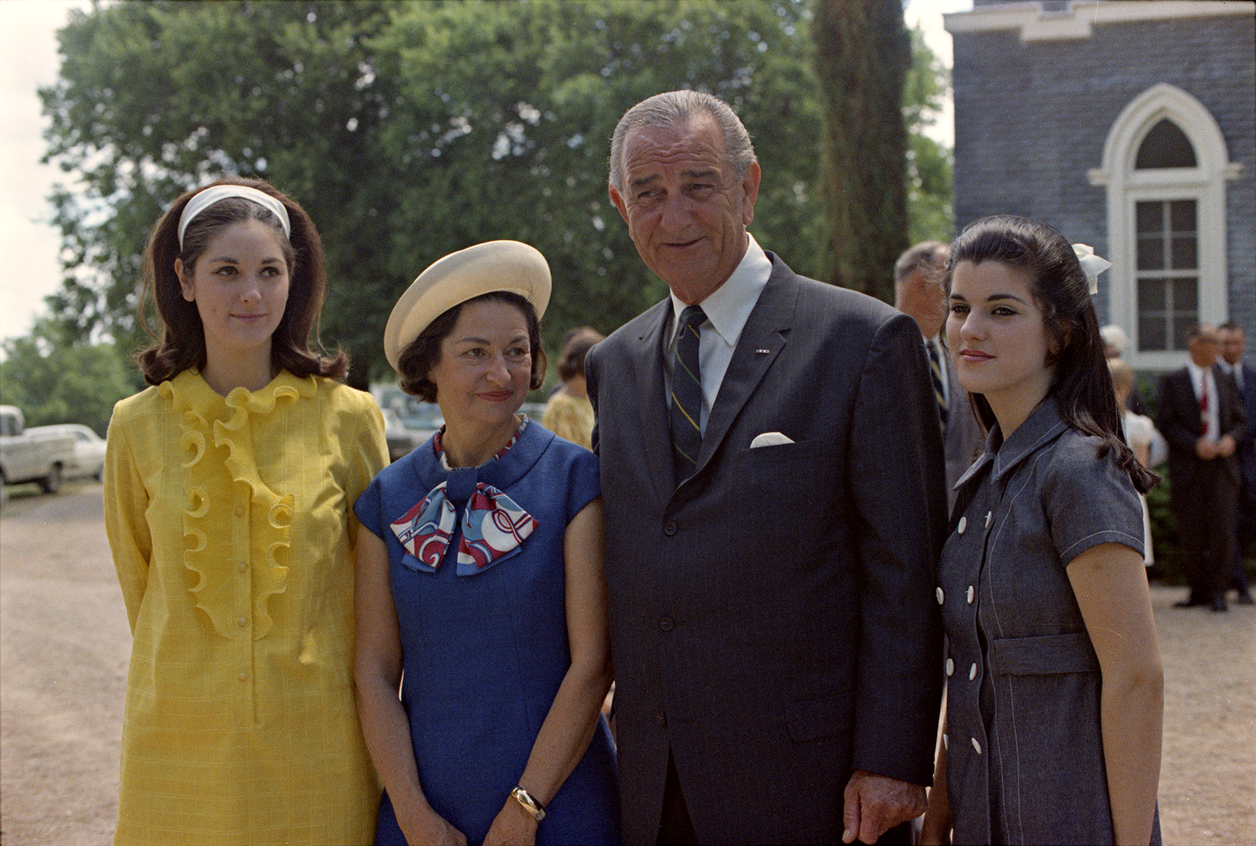 LBJ and Lady Bird with daughters Lynda and Luci outside of the Trinity Lutheran Church in Stonewall, Texas.