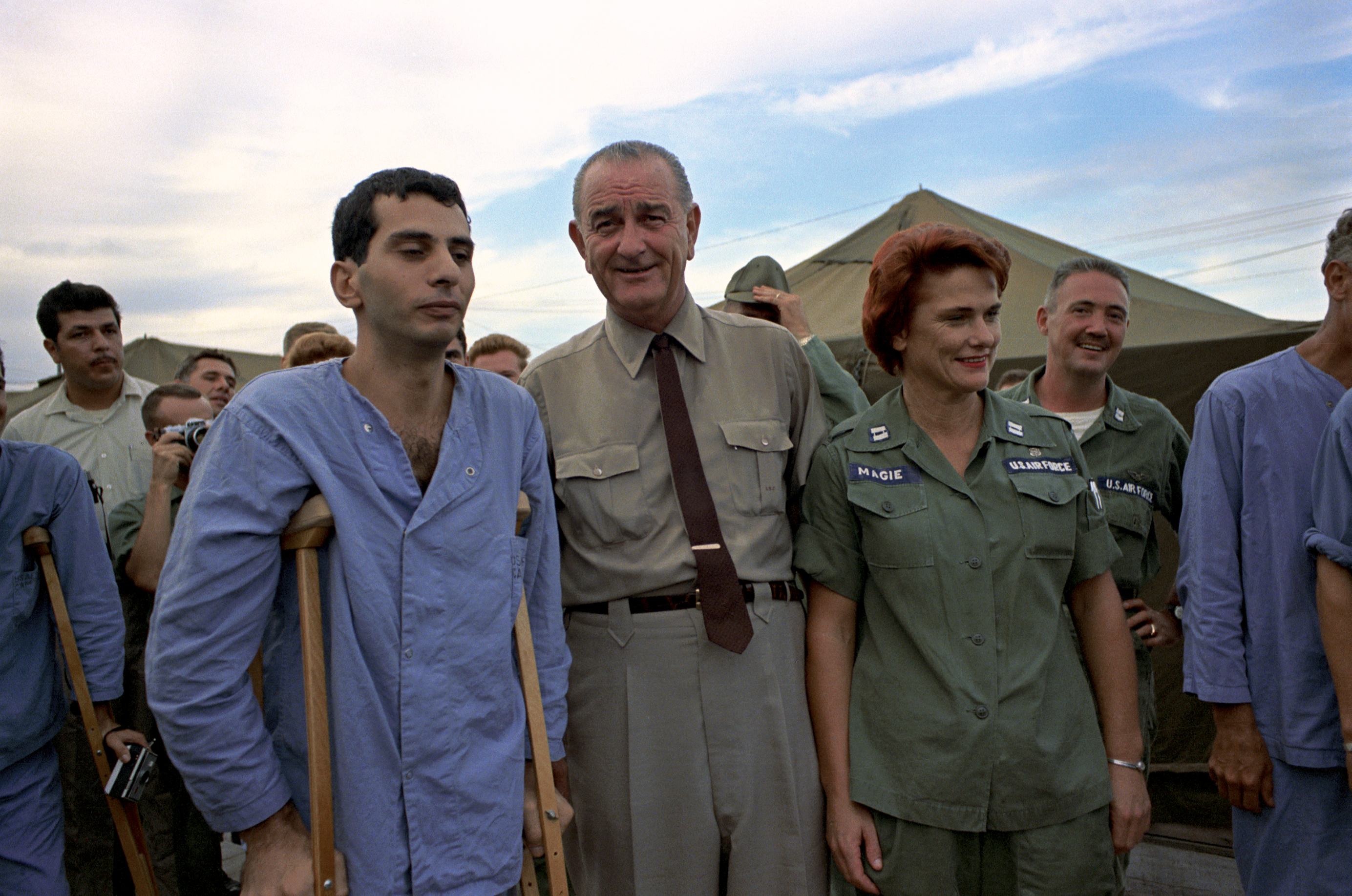 President Johnson visits with wounded soldiers, doctors, and nurses while visiting the base hospital at Cam Ranh Bay in South Vietnam. LBJ Library photo by Jay Godwin #DIG14317-062.