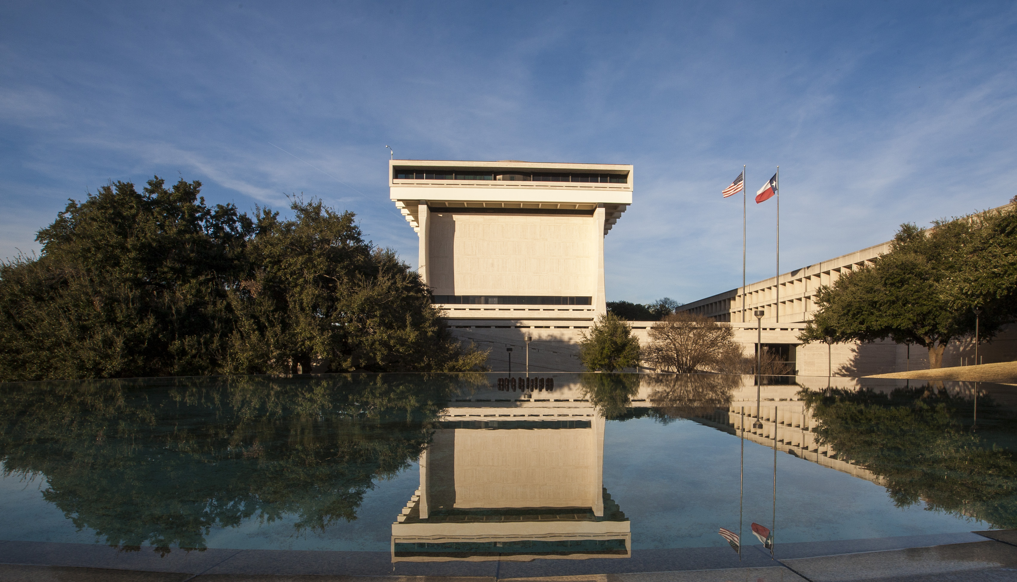 The LBJ Presidential Library in Austin, Texas, reflected in the LBJ fountain.