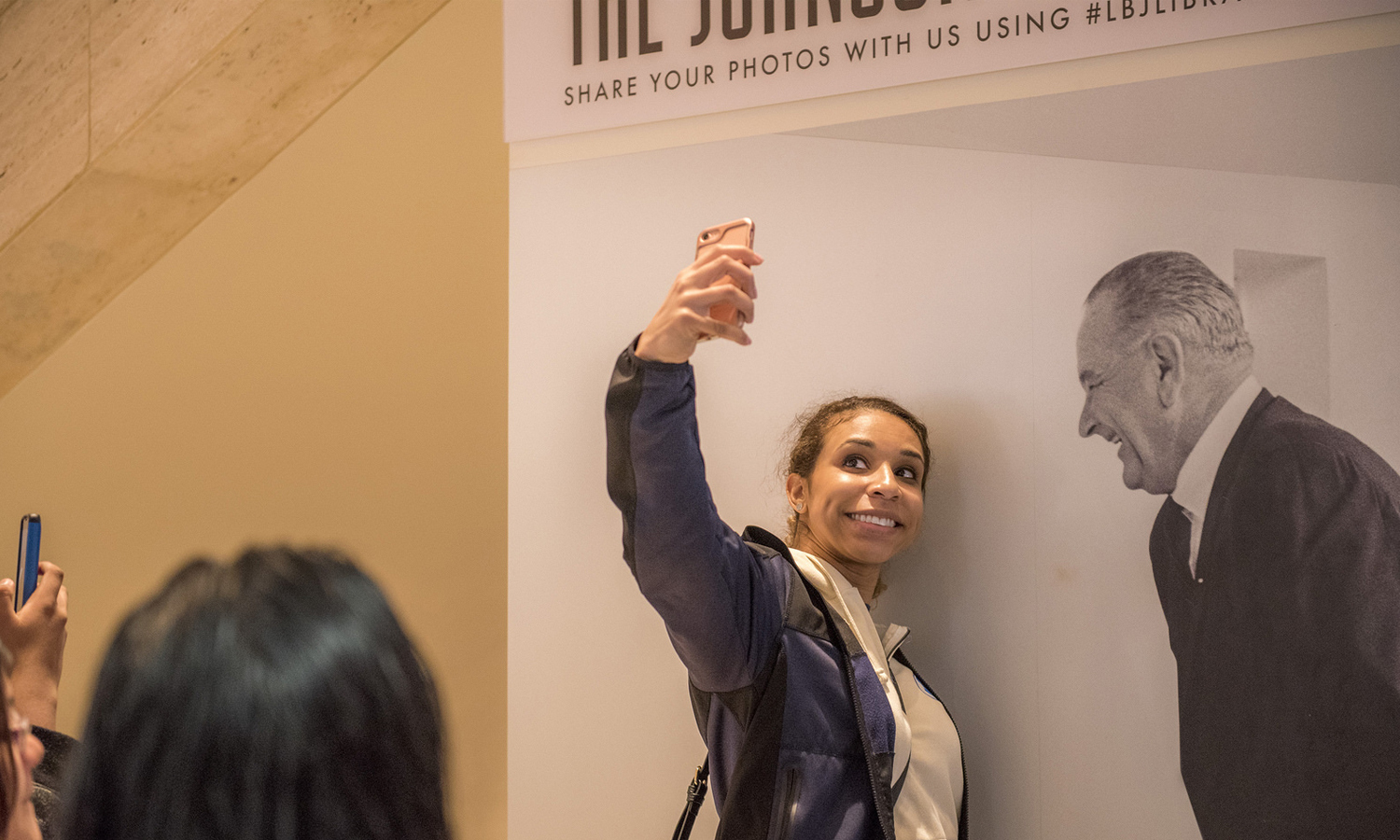 Lindsey Clayborn gets a selfie with President Johnson. LBJ Library photo by Jay Godwin #DIG14026_171.