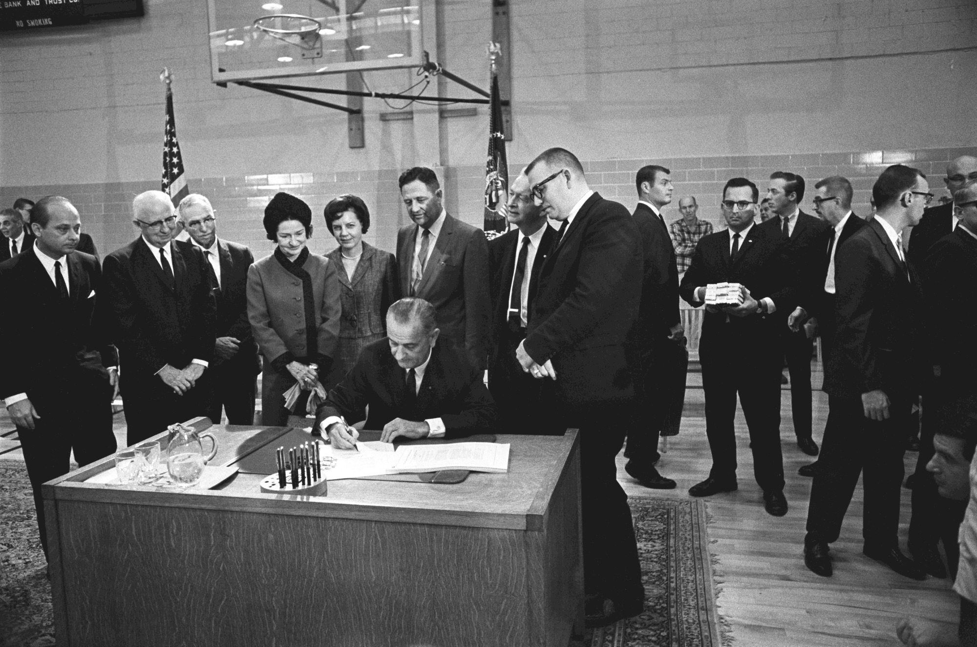 President Lyndon B. Johnson signs the Higher Education Act.
