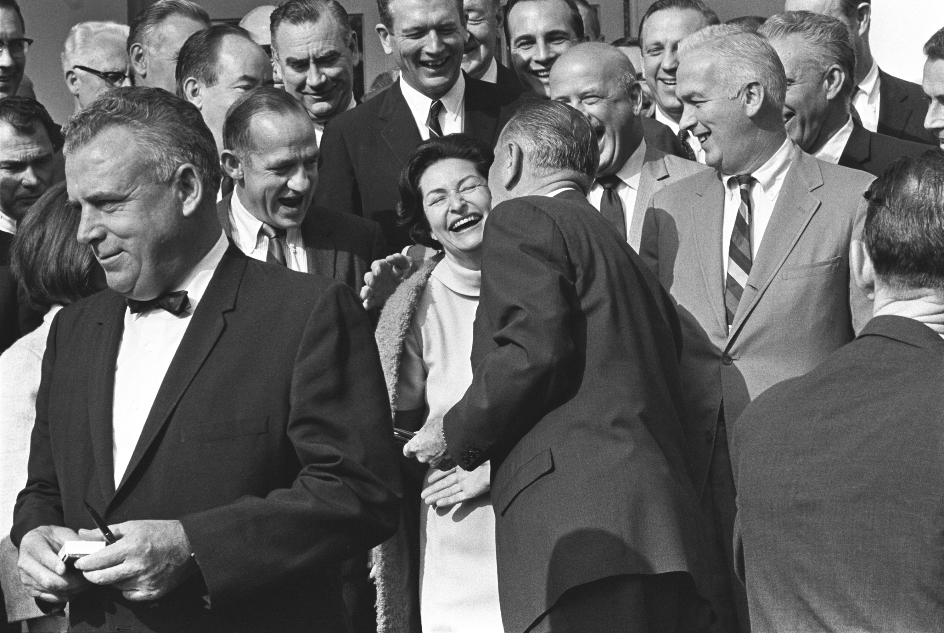 President Johnson kisses Lady Bird Johnson on the cheek at the signing of the National Foundation on the Arts and the Humanities Act.
