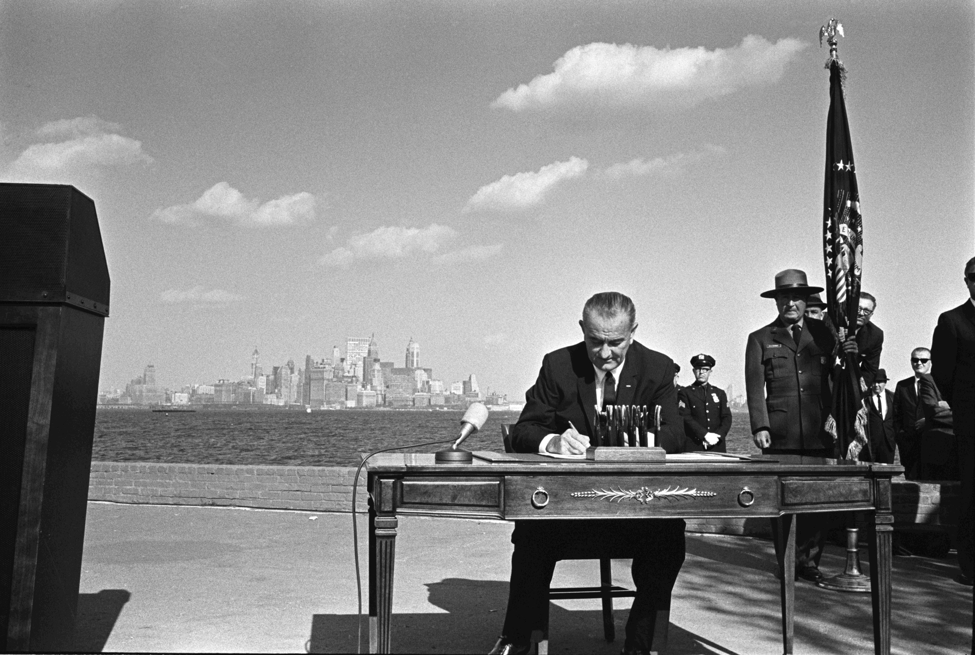 President Lyndon B. Johnson signs the bill.