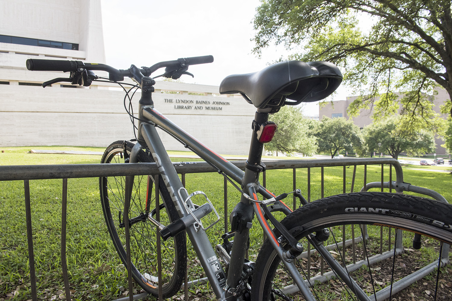 An image of a bike locked on a bike rack on the south side of the LBJ Library