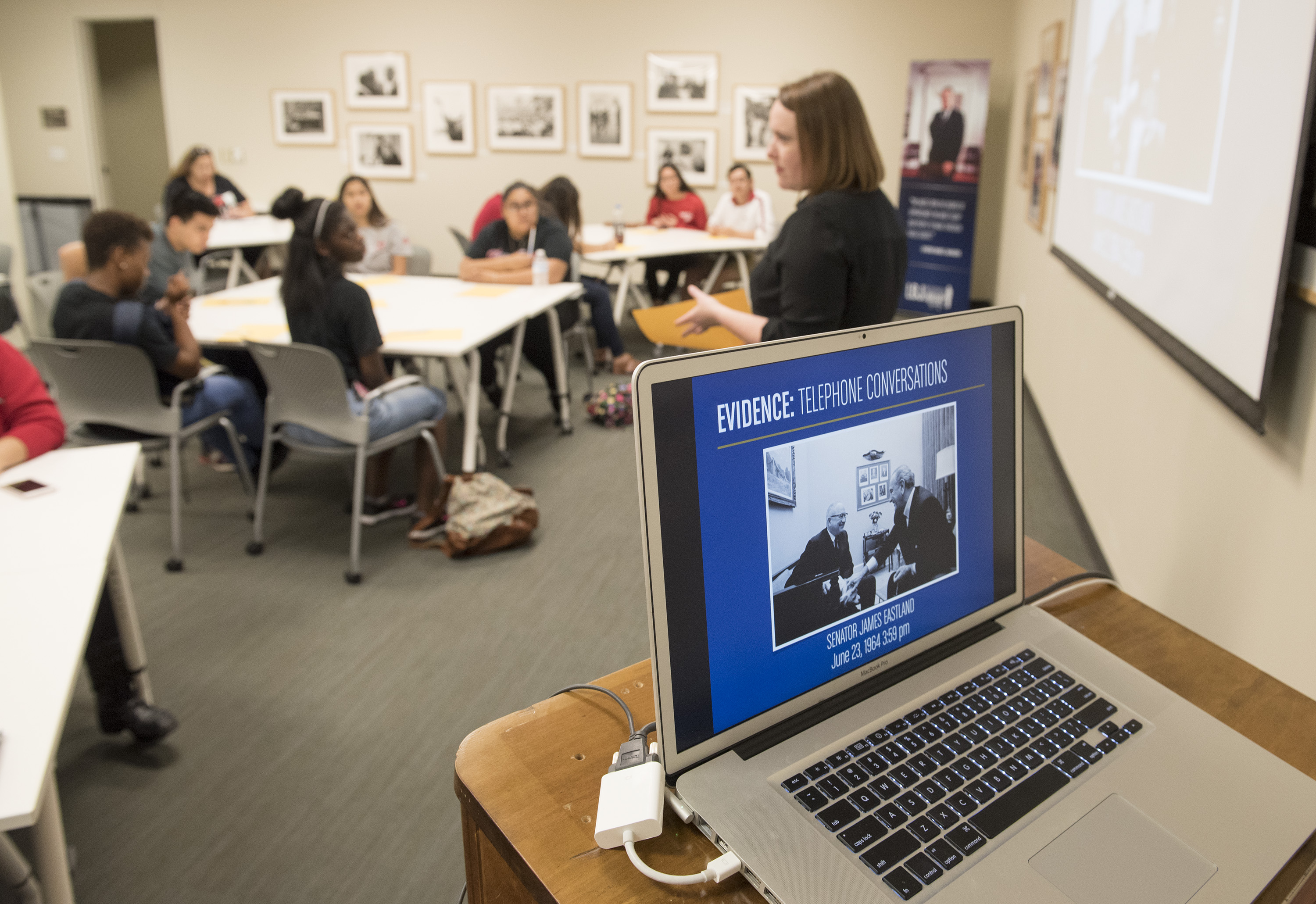A close up of a computer with a presentation about LBJ's telephone conversations.