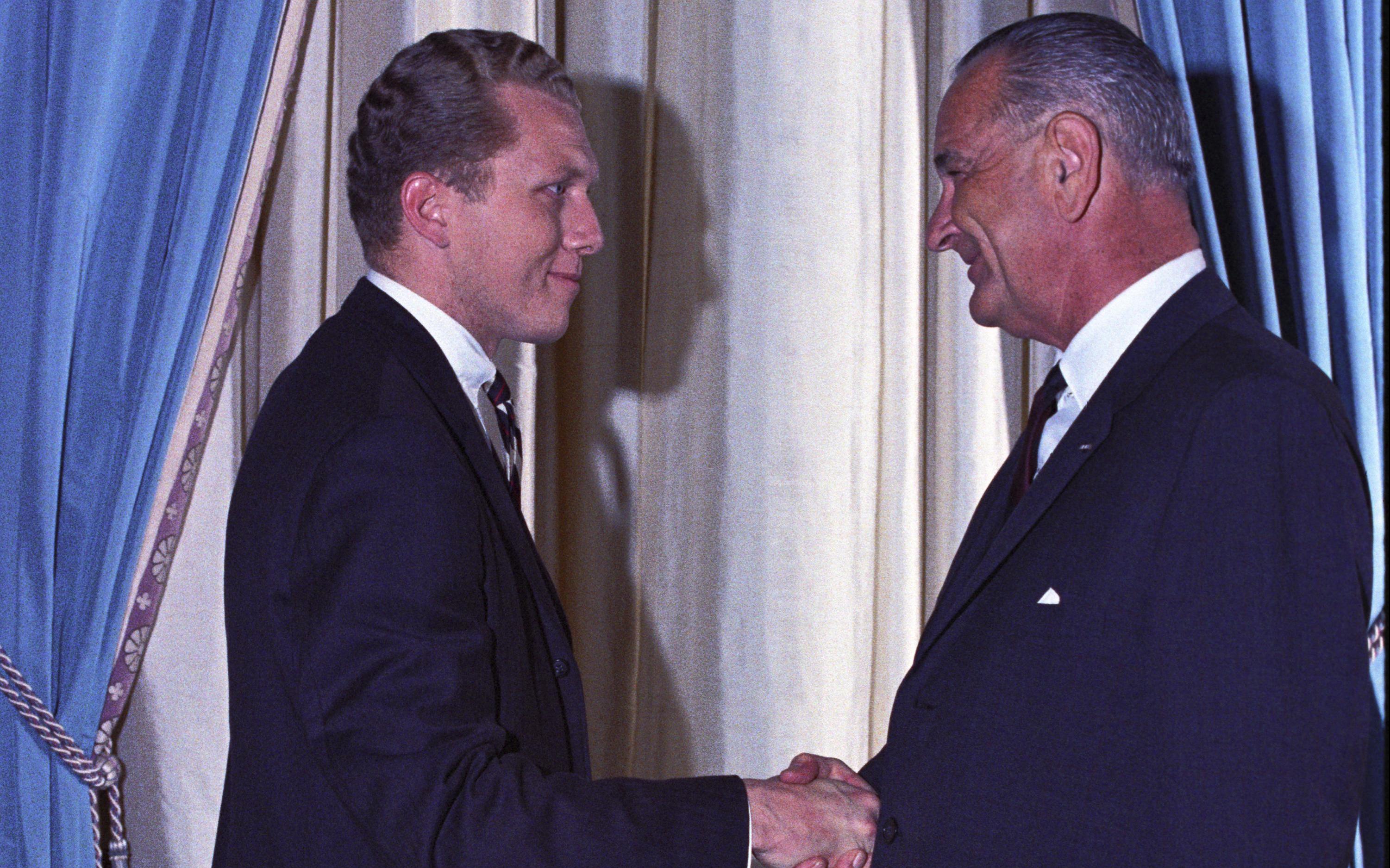 L-R: Robert (Bob) Hardesty and President Lyndon B. Johnson. President Johnson shakes hands with Robert Hardesty during a receiving line for the Businessmen's Dinner.