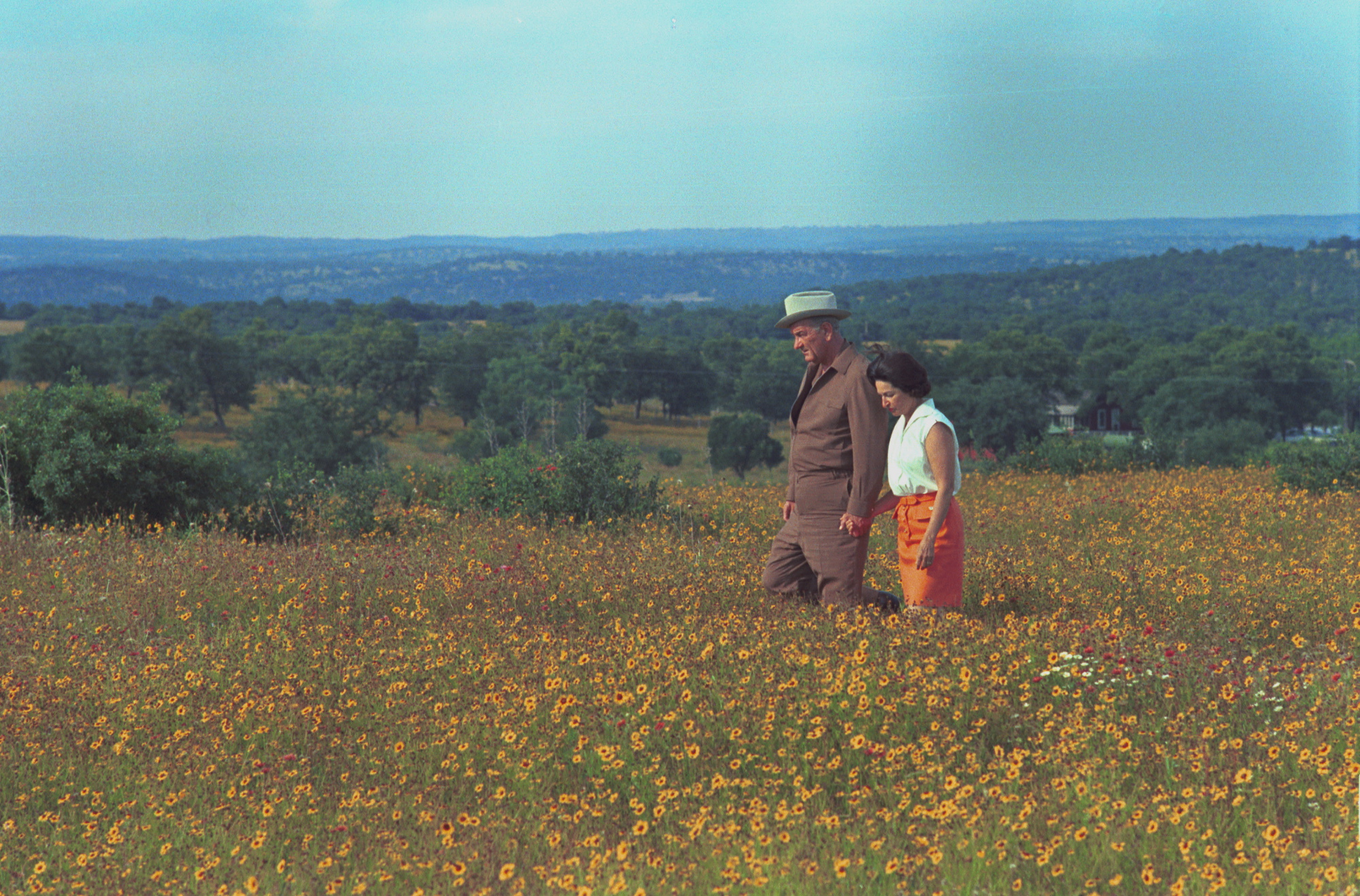 LBJ and Ladybird walking among wildflowers