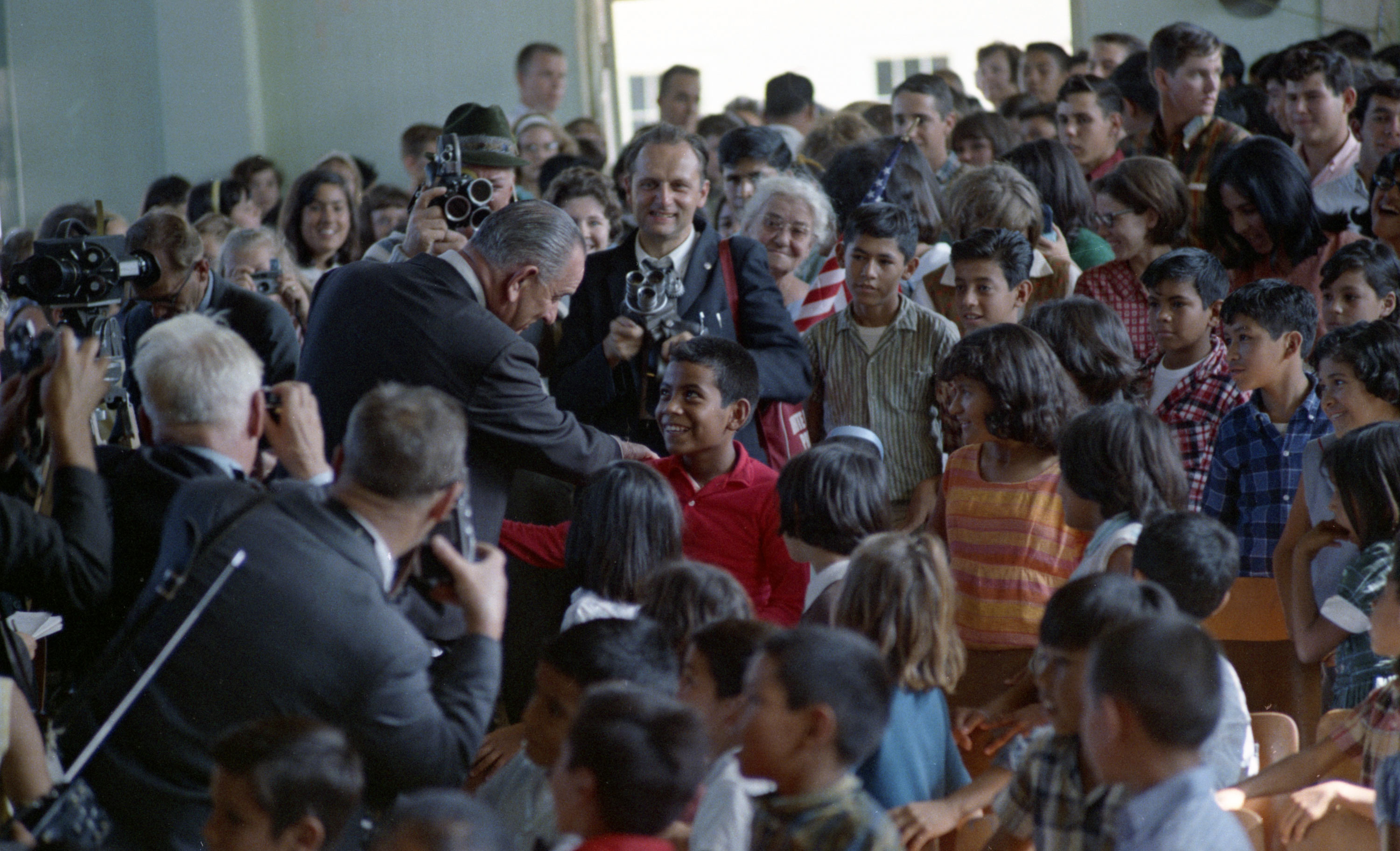President Lyndon B. Johnson greets citizens of Cotulla, photo by Mike Geissinger