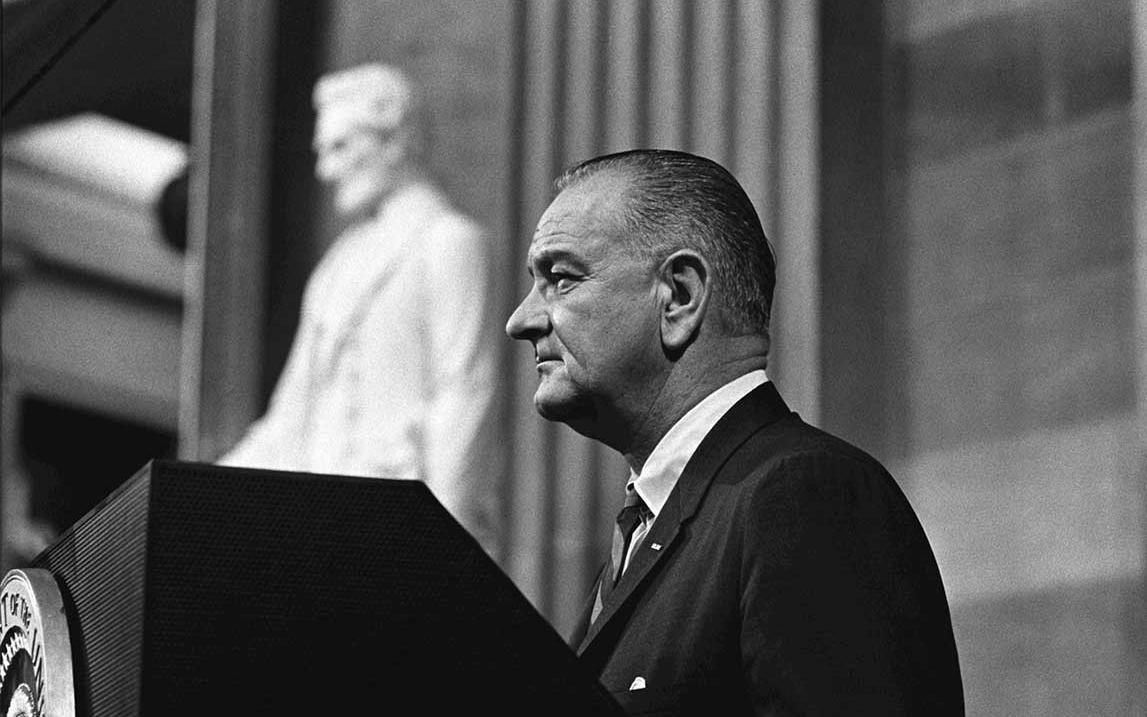Photo - LBJ giving speech regarding voting rights act of 1965 - LBJ Library