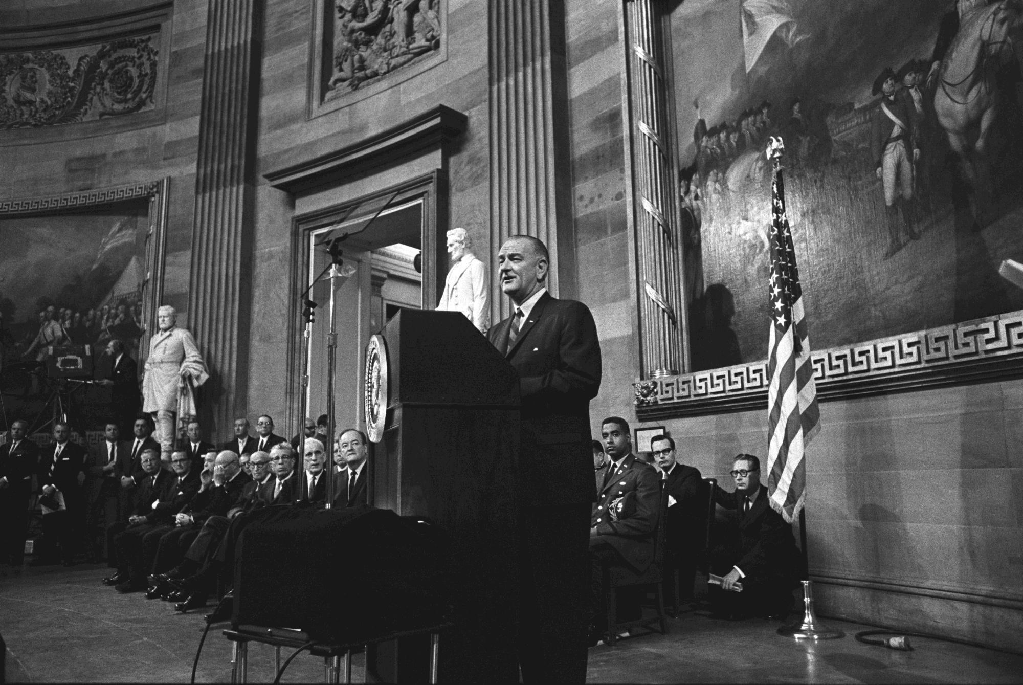 President Lyndon B. Johnson gives remarks inside the U.S. Capitol rotunda before signing the Voting Rights Act.