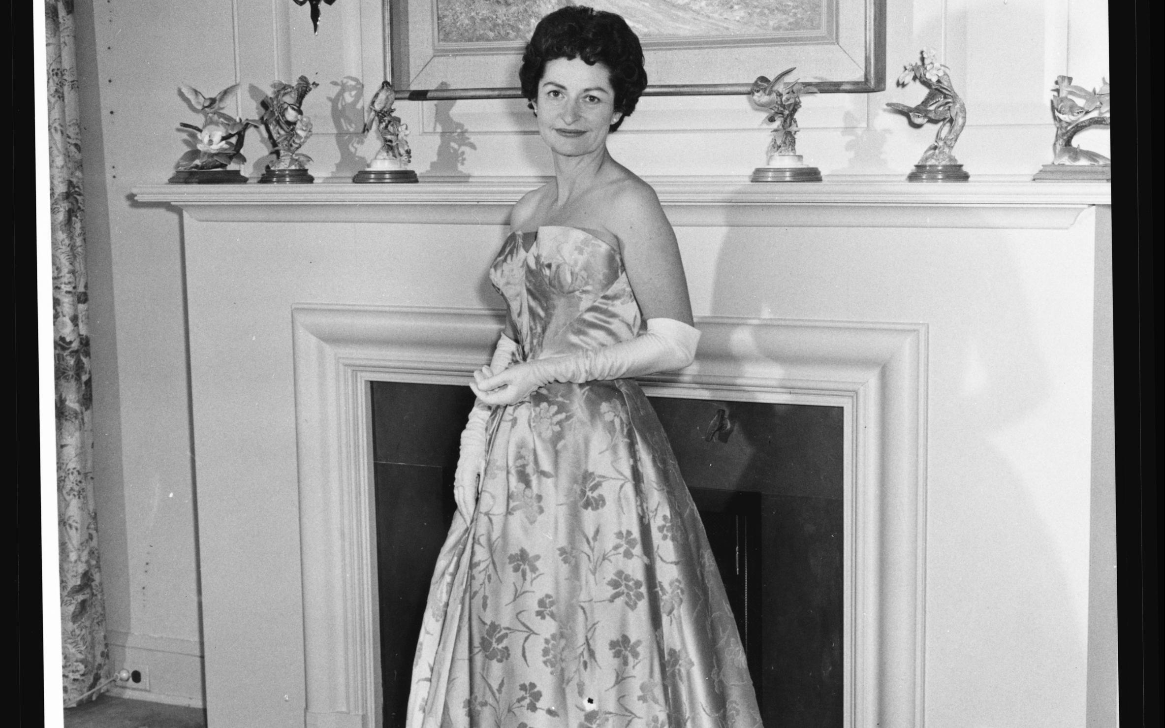 Lady Bird Johnson poses in the formal gown she wore to the 1961 inaugural ball.