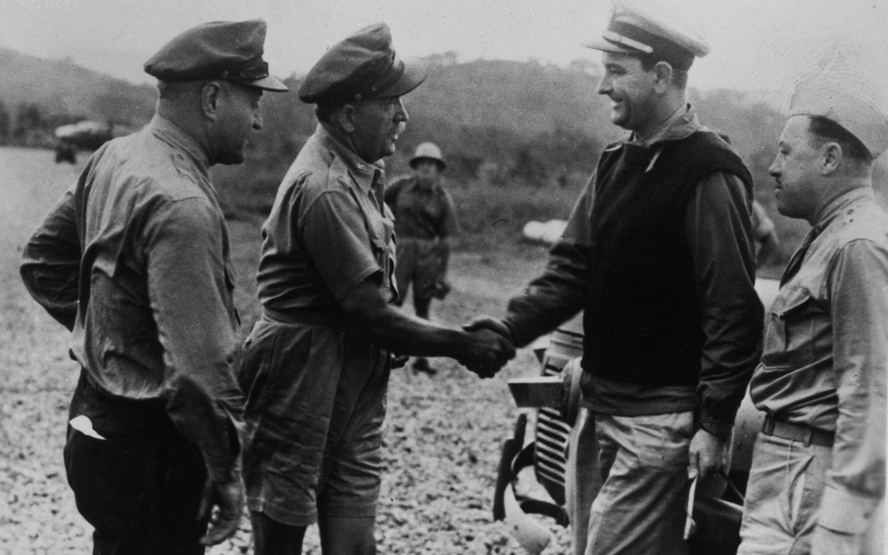 Gen. Ralph Royce and Brig. General Martin F. Scanlon greet Lt. Commander Lyndon B. Johnson upon his arrival at Seven-Mile Air Drome near Port Moresby, New Guinea, on June 9.