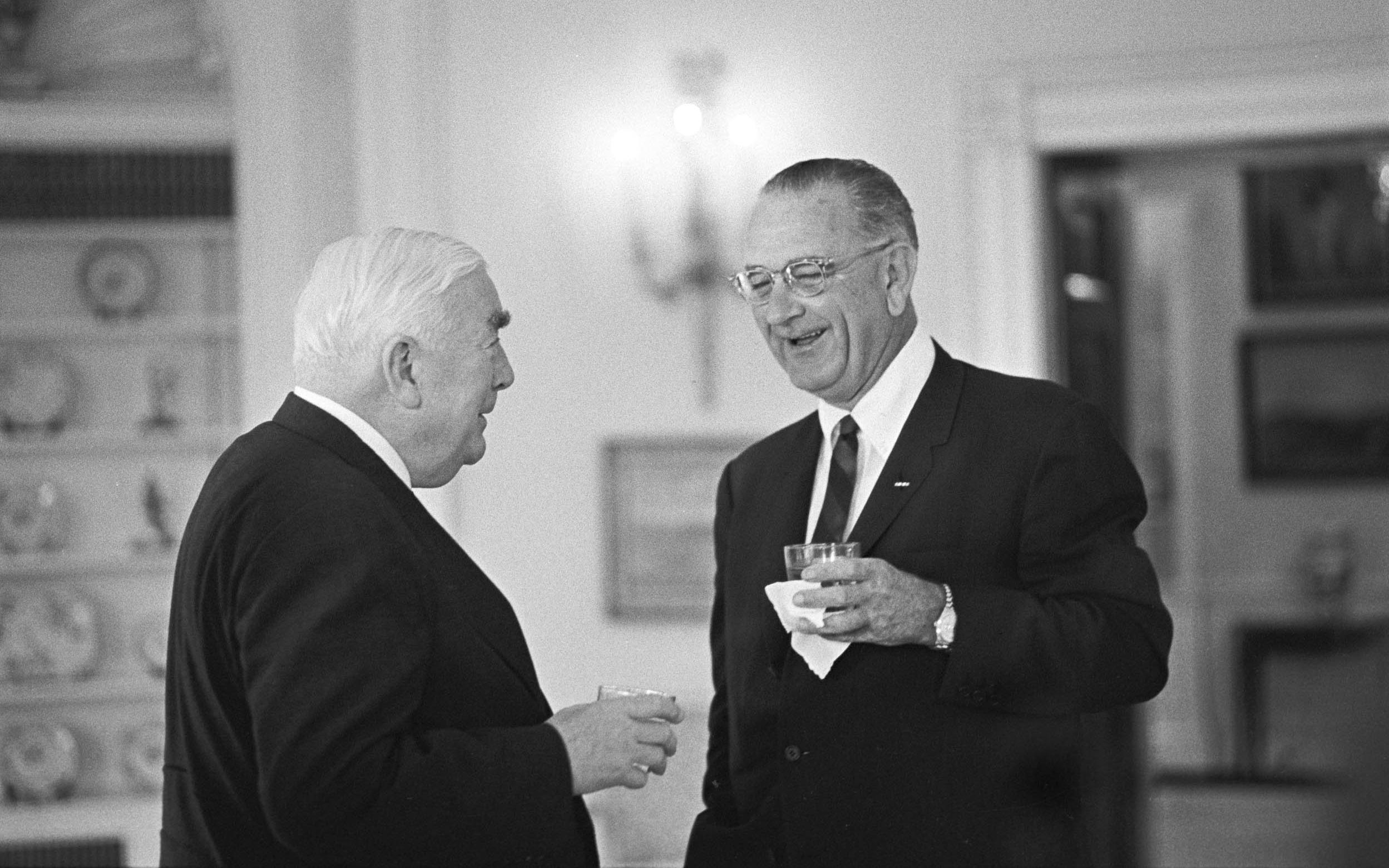 Prime Minister of Australia Robert Menzies and President Johnson, standing with drinks in the Oval Office
