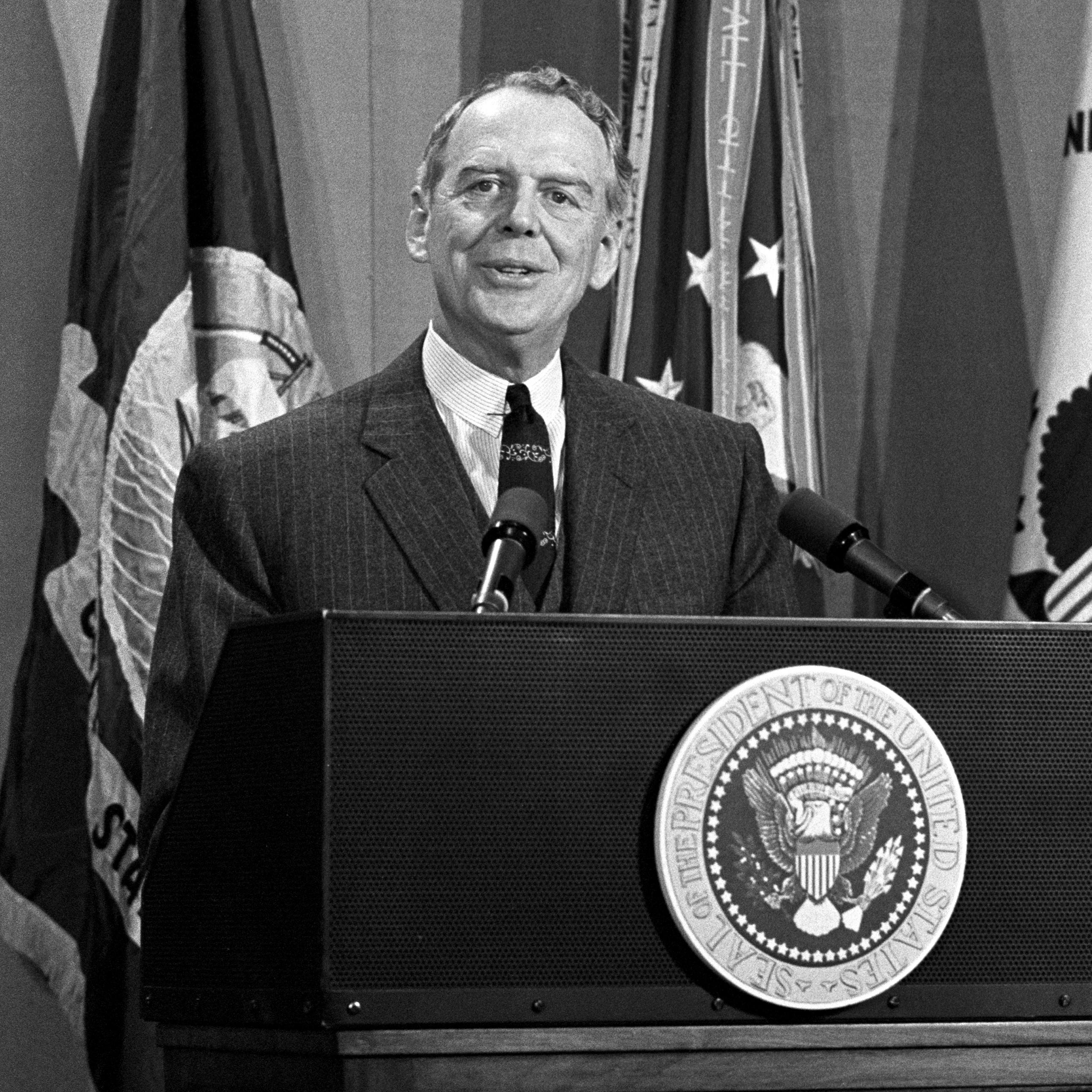 Clark M. Clifford speaks at a podium