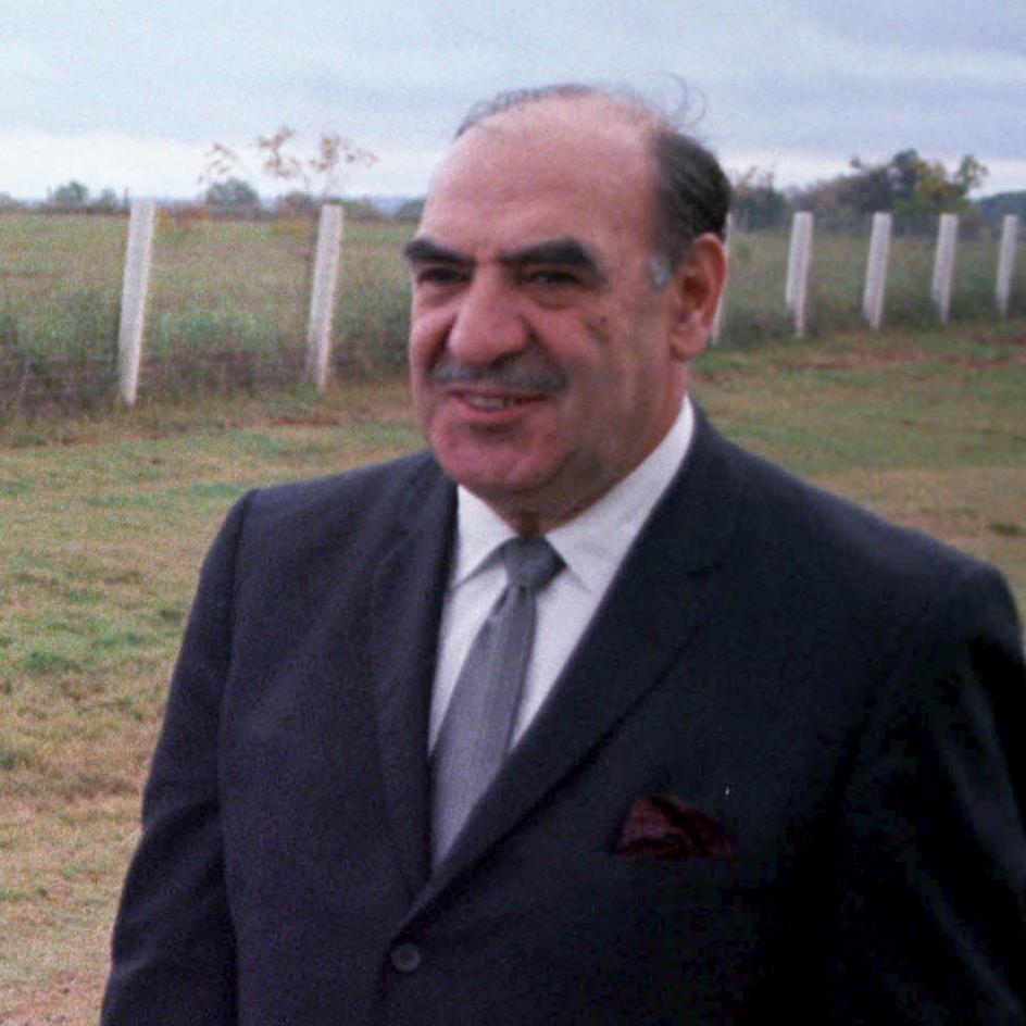Tight shot of Anthony J. Celebrezze walking besides President Johnson (out of frame) at the LBJ ranch
