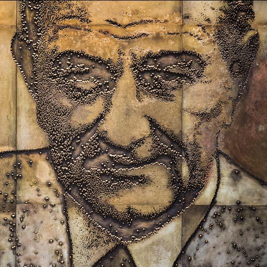 A section of a 50-foot-long mural that shows Lyndon Johnson a various stages of his career.