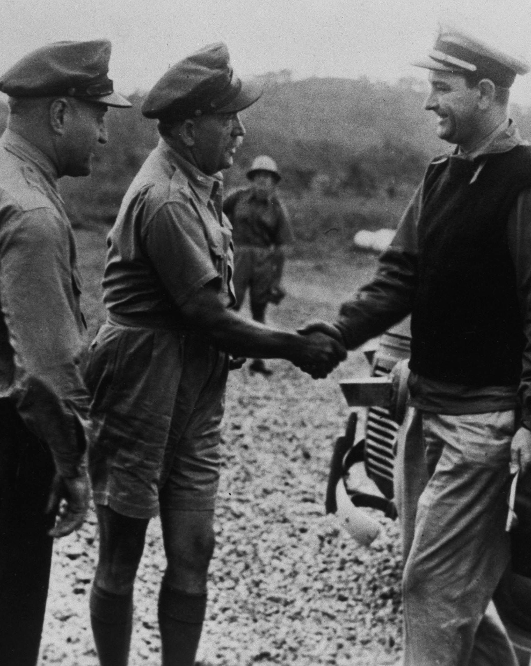 Gen. Ralph Royce and Brig. General Martin F. Scanlon greet Lt. Commander Lyndon B. Johnson upon his arrival at Seven-Mile Air Drome near Port Moresby, New Guinea, on June 9.