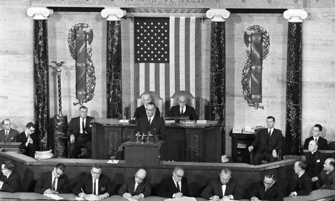 President Lyndon B. Johnson gives the State of the Union Address. LBJ Library photo by Cecil Stoughto #3-6-WH64 .