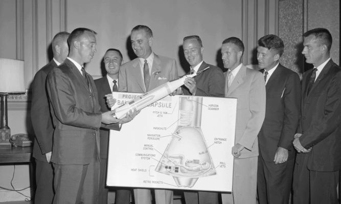 L-R: Alan Shepard, John Glenn (behind Shepard), Gus Grisson, Sen. LBJ Library photo by Lyndon B. Johnson, Scott Carpenter, Gordon Cooper, Walter Schirra, Deke Slayton. Frank Muto #59-5-3.3