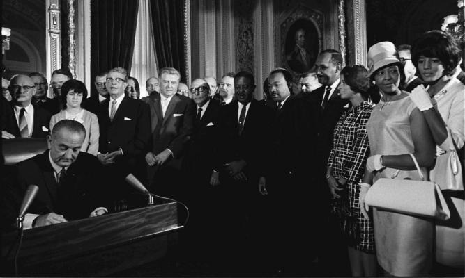 President Lyndon B. Johnson and group including Rev. Abernathy (?) , Rev. Martin Luther King, Jr., Clarence Mitchell, and Patricia Roberts Harris. LBJ Library photo by Yoichi Okamoto #A1030-19a.