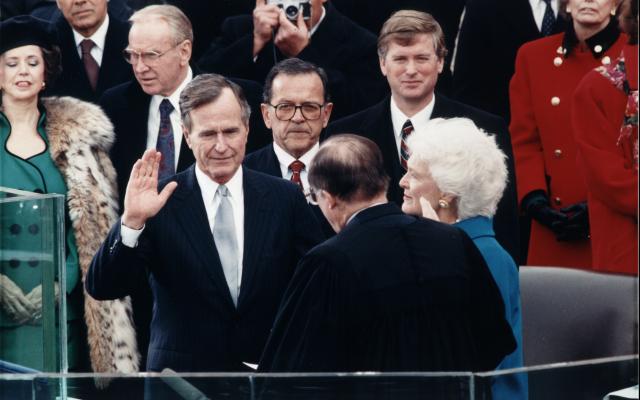 George H. W. Bush takes the oath of office to become president of the United States