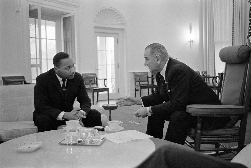 Martin Luther King, Jr. talks with President Lyndon B. Johnson